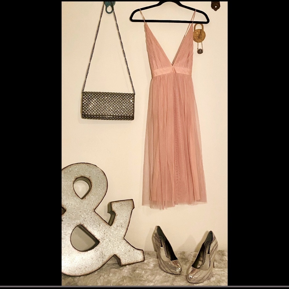 Delicate rose with a bold plunge. So flattering. S